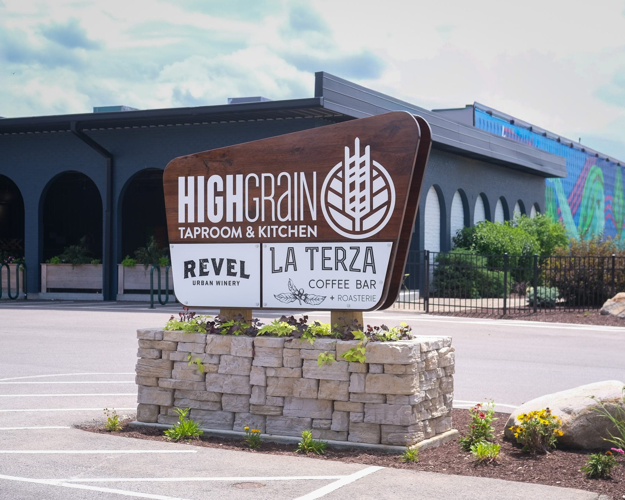 HighGrain Taproom & Kitchen sign with Revel and La Terza signs out front