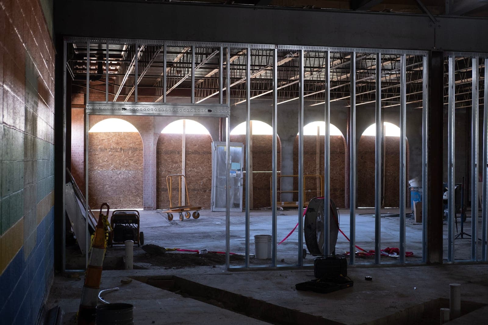 New metal framing inside the arched front windows