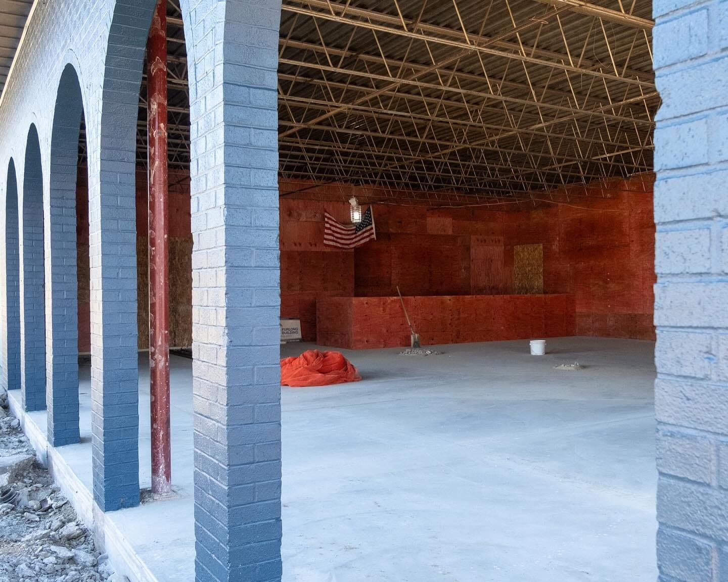 The arched entry of the Brentwood building with fresh brick and a new floor