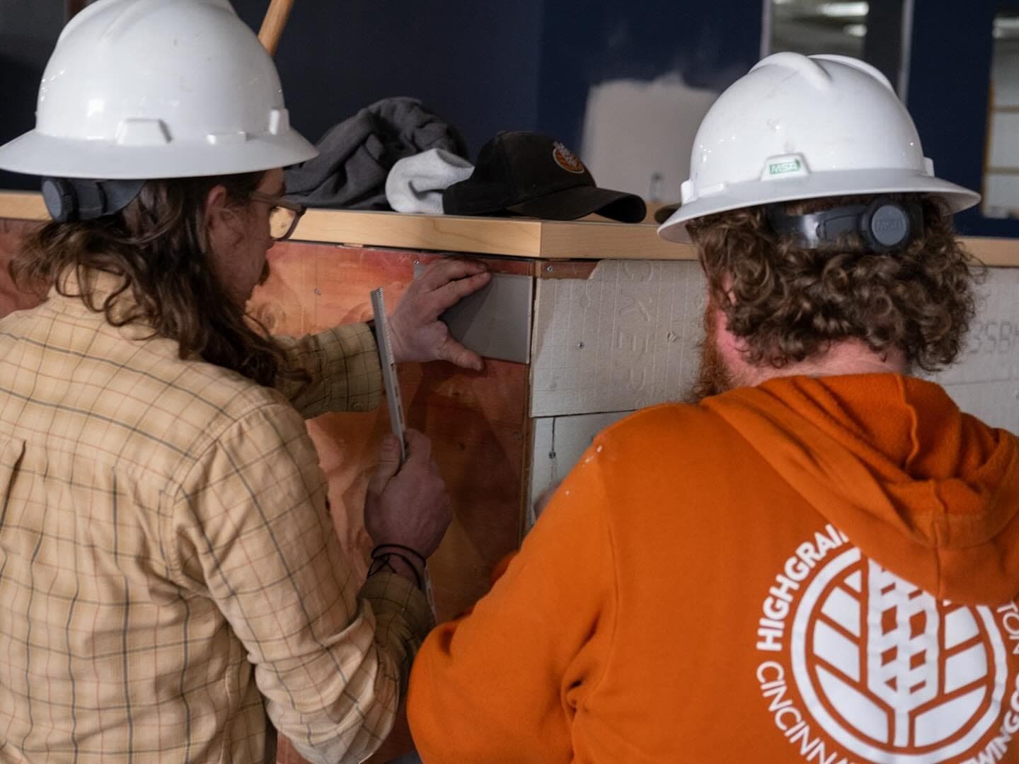 HighGrain crew in hard hats building the bar