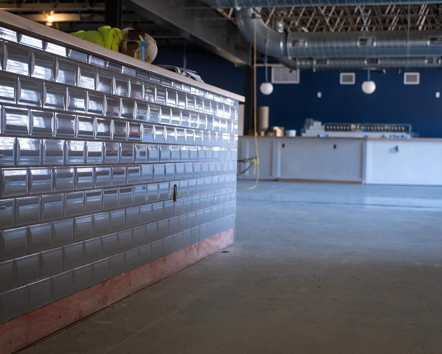 The food and coffee bar front, made from tile reclaimed from another construction project