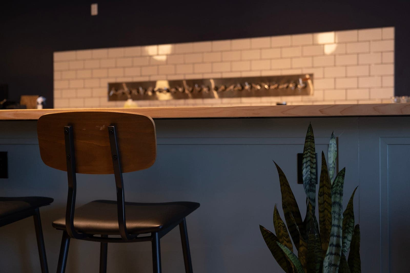 Bar seating and the finished tile wall