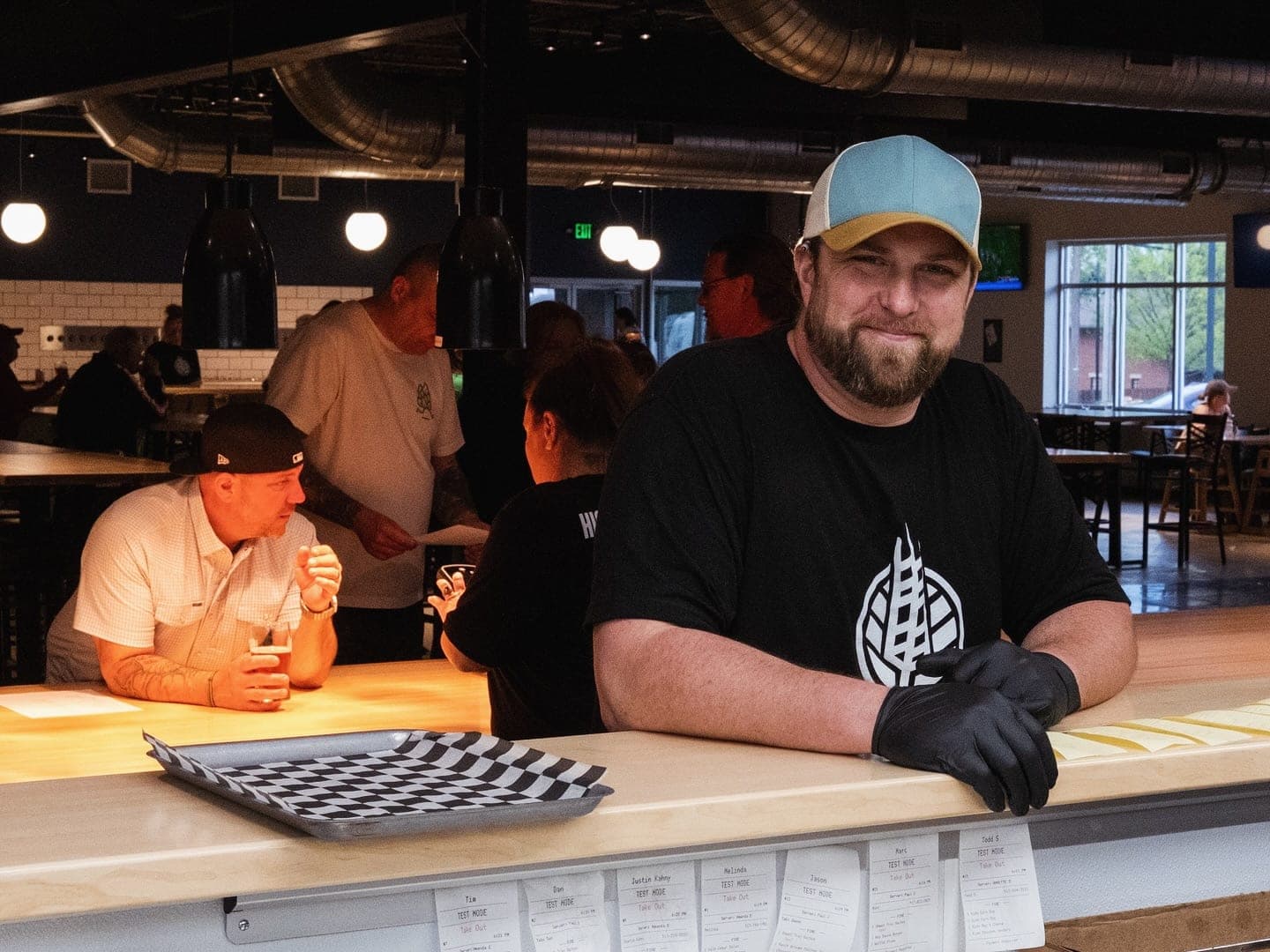 The HighGrain Brentwood kitchen team at the counter during opening week
