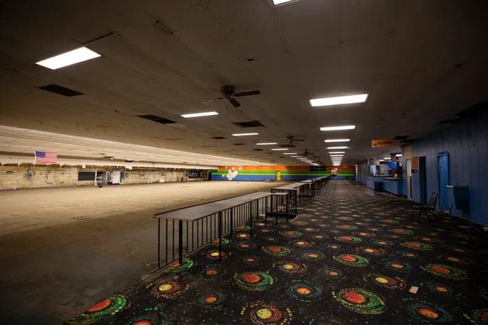 The empty lanes and cosmic carpet inside the closed Brentwood Bowl