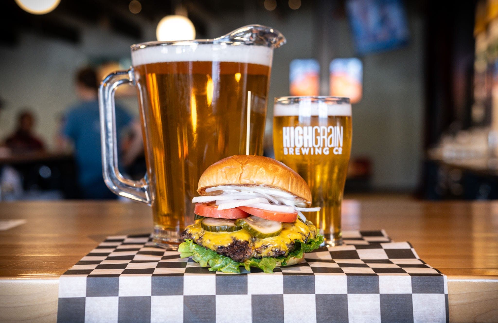 Cheeseburger with a pitcher and pint of HighGrain beer
