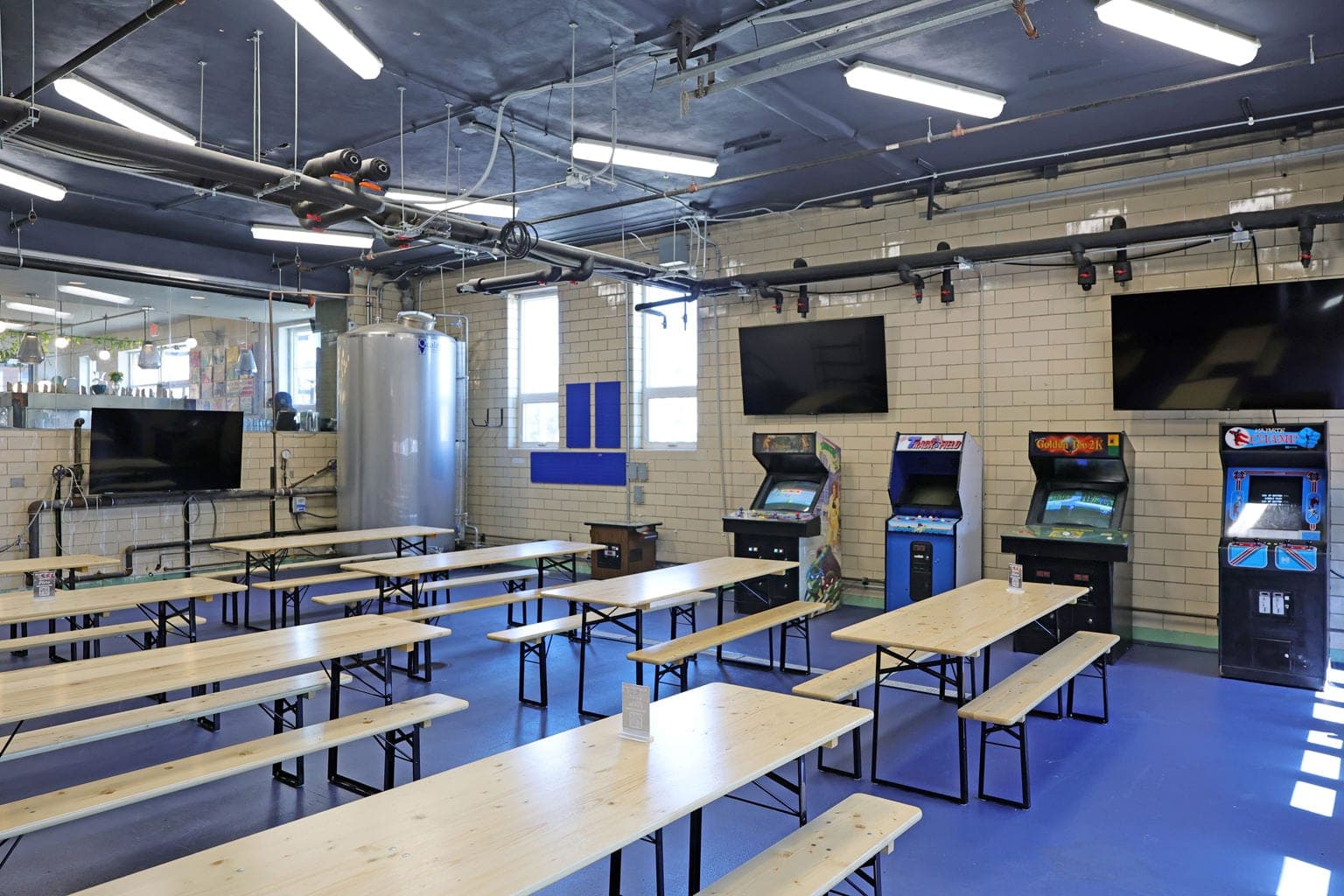 Arcade machines and beer-hall tables in the Silverton game room
